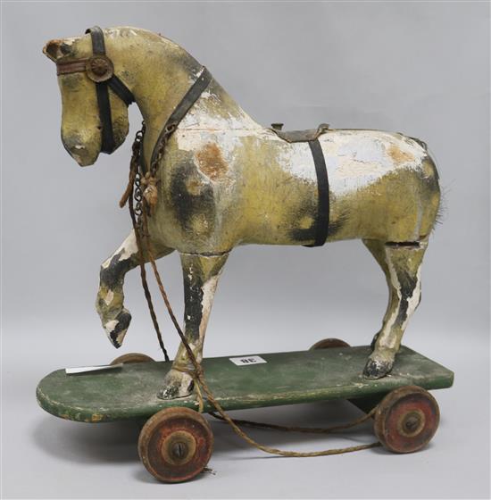A Victorian painted carved wood pull-along horse